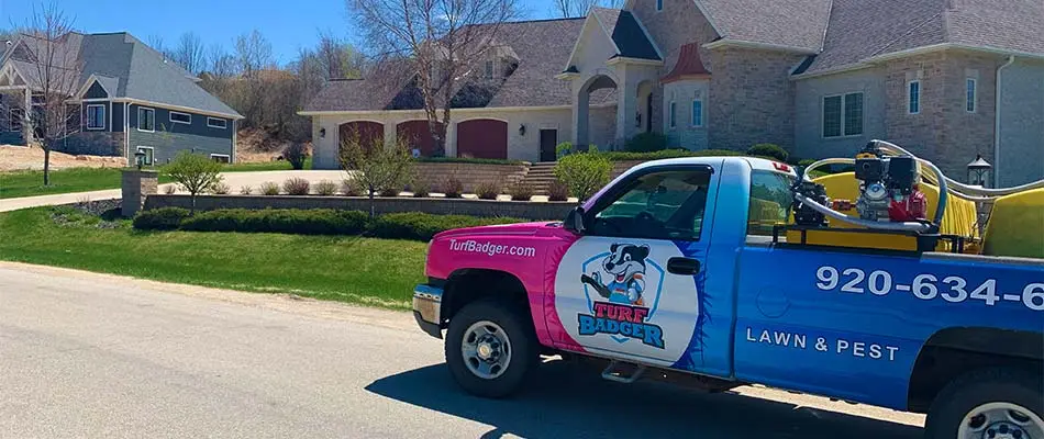 Turf Badger lawn care service truck at a home in De Pere, WI.