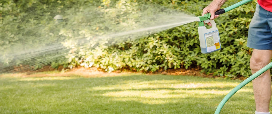 Our lawn care specialist performing liquid aeration in Green Bay, WI.